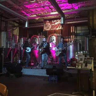 a band playing in a brewery