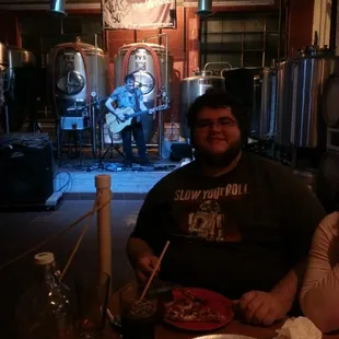 Sam enjoying some pizza and live music at the Weasel!