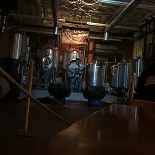 a man and a woman in a brewery