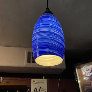 a blue glass pendant light
