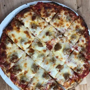 a sliced pizza on a plate