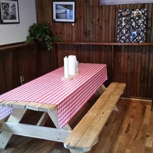 lots of communal picnic tables inside, with sauce and a roll of paper towels instead of napkins