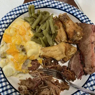 Cheese potatoes, pulled pork, brisket, naked wings, green beans. So so good!!