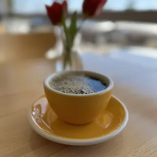 a cup of coffee on a saucer