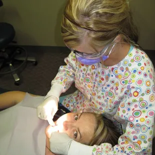Dental Hygienist assisting a child