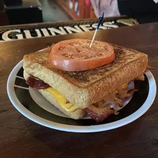 a bacon, egg, and tomato sandwich