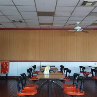 a dining room with tables and chairs