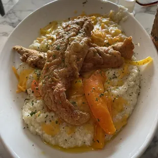 Fish and Grits cooked to perfection! Hubby and I shared this plate...
