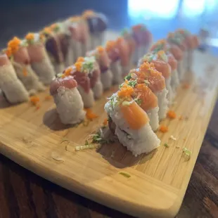 sushi rolls on a wooden board