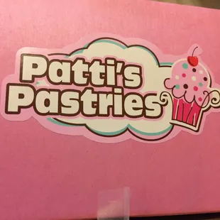 a pink box with a cupcake on it
