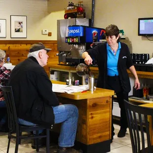 a waitress serving customers