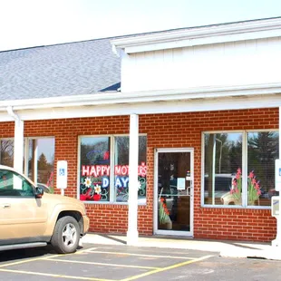 two cars parked in front of the building