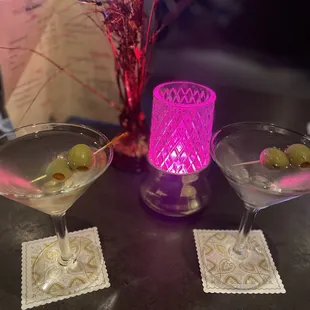 three martinis with olives