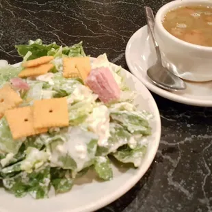 Green salad with blue cheese dressing, salami bits and Cheez-its plus sausage and Bean soup