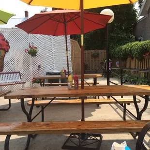 Patio dining area.  Three picnic tables, two - four chair tables and a bench.  Can get a little crowded outside at times.
