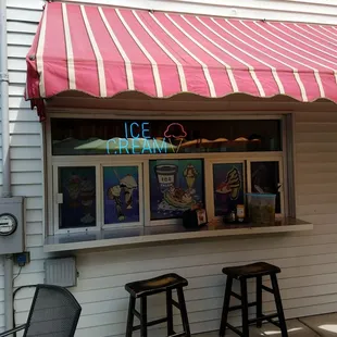Looks like they may have used these windows for ordering ice cream, but now it's just counter seating