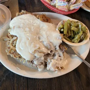 Texas Chicken Fried Steak w/ fried onions &amp; white gravy on top. Texas toast underneath it all. Side of green beans. Delicious!