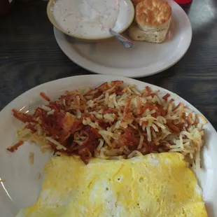 3 egg omelette with hash browns and biscuits and gravy.