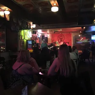people sitting at a bar