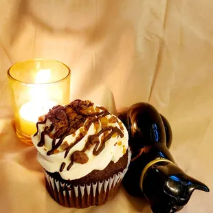 a cupcake and a bottle of beer