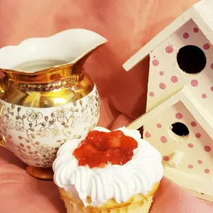 a cupcake and a birdhouse