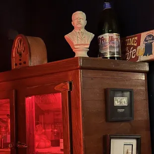 a bust of a man on top of a cabinet