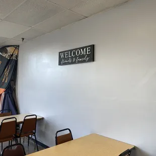 a welcome sign on the wall