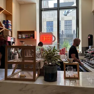 two people working in a coffee shop
