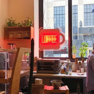 a man standing in a coffee shop