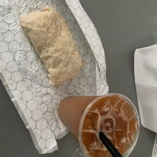 a cup of iced coffee and a sandwich