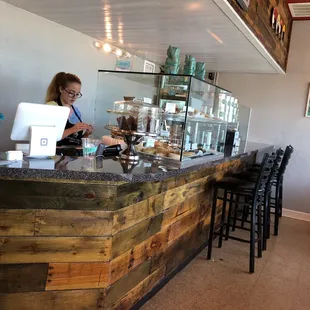 a woman behind the counter