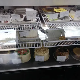 Slices of cake $2.50, whoopie pie $1.50, macaroon .99,  peanut butter ball $2.99 lemon cheesecake bar $2.50
