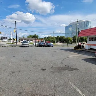 The parking lot at the side of the building.