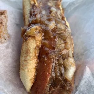 a hot dog covered in caramel