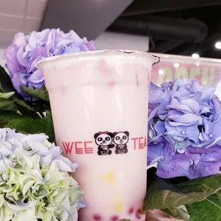 a cup of bubble tea and flowers