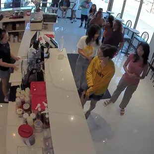 a group of people in a coffee shop