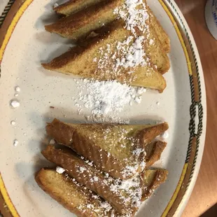 Sausage breakfast biscuit, powdered sugar French toast, and the menu at Weeze's!