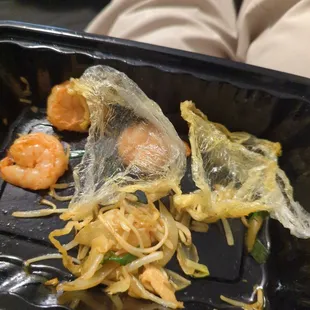 shrimp and noodles in a plastic container