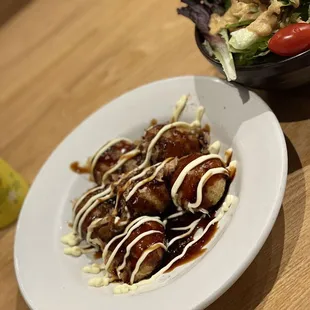 a plate of food and a bowl of salad