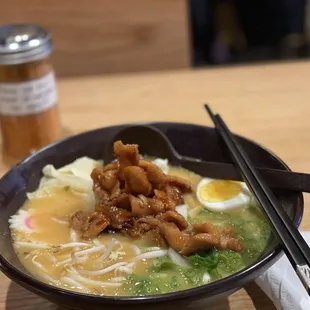 a bowl of ramen and chopsticks