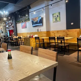 Nice restaurant seating with extra condiments in the middle