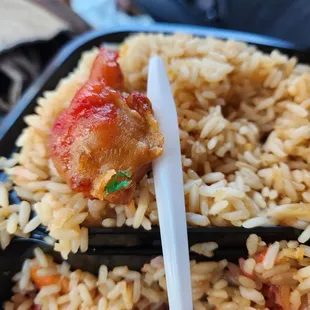 rice and meat with chopsticks