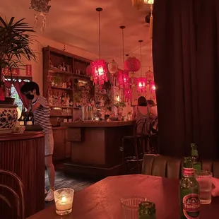 a woman standing at a bar