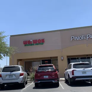 three cars parked in front of a restaurant