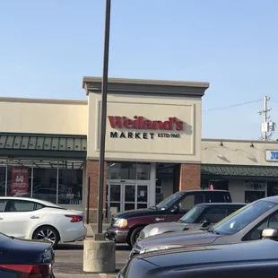 cars parked in front of the store