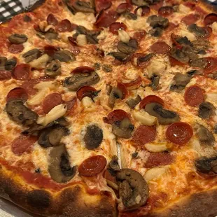 A pepperoni, roasted garlic, and truffle mushroom pie. DELICIOUS!!!