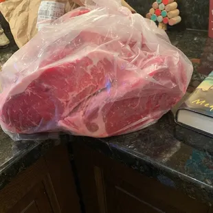 a large piece of meat wrapped in plastic