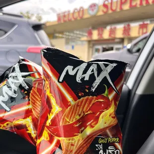 a bag of chips in the passenger seat of a car