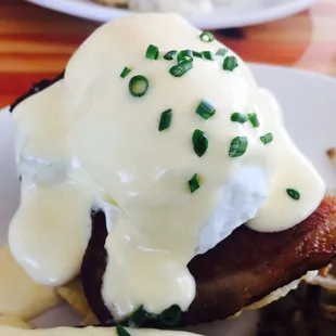 Eggs benedict with pork belly