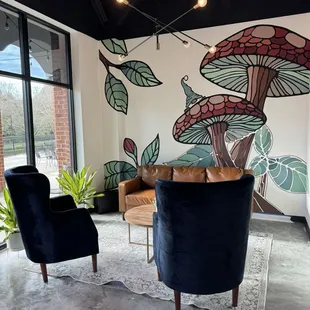 a living room with a mural of mushrooms